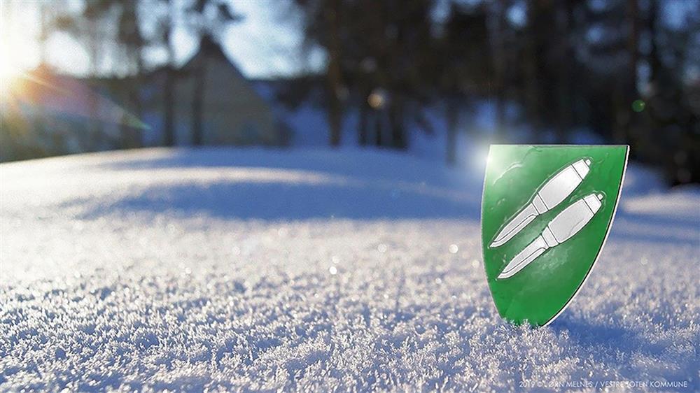 Bakgrunn 10: Kommunevåpen i vintersol.  Illustrasjon og design: Jørn Melnes - Klikk for stort bilde